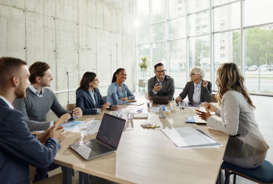 Cheerful team meeting in a bright office